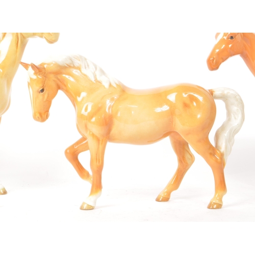 43 - Beswick - A collection of three 20th-century china Palomino horse pony figurines, comprising of two ... 