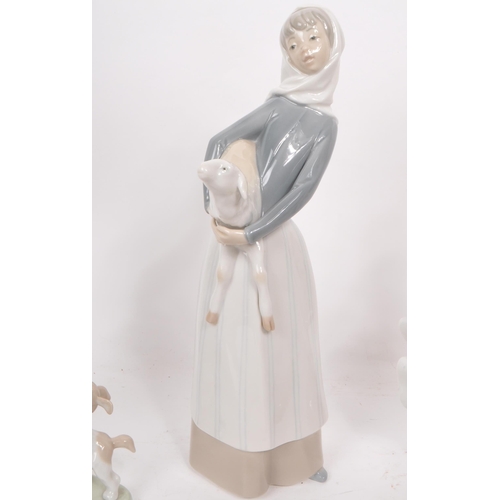 438 - Lladro - Nao - Collection of seven late 20th century porcelain figurines, comprised of two small goo... 