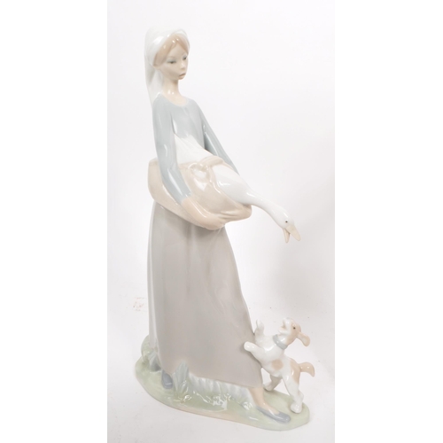 438 - Lladro - Nao - Collection of seven late 20th century porcelain figurines, comprised of two small goo... 