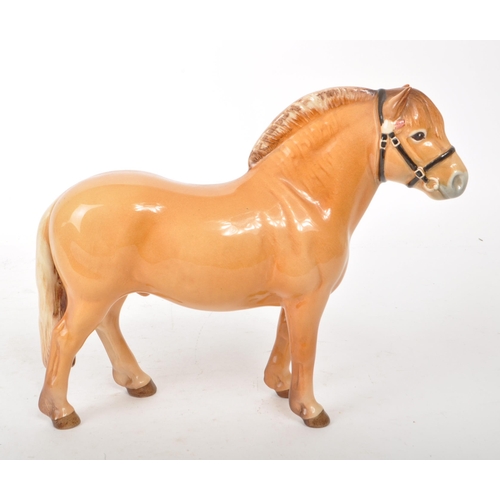 44 - Beswick - A 1970s china Norwegian Fjord pony figurine, featuring a chestnut brown colour, with bridl... 