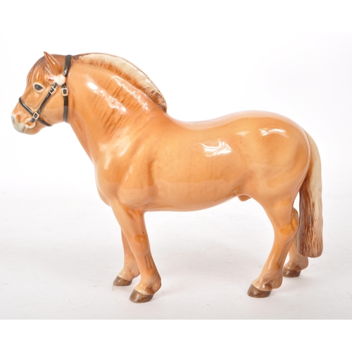 44 - Beswick - A 1970s china Norwegian Fjord pony figurine, featuring a chestnut brown colour, with bridl... 