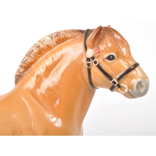 44 - Beswick - A 1970s china Norwegian Fjord pony figurine, featuring a chestnut brown colour, with bridl... 