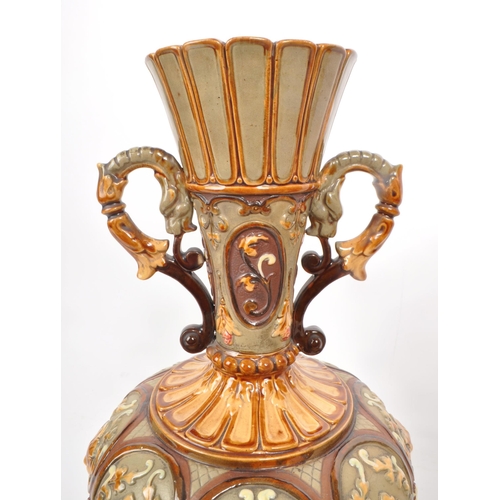 441 - Wilhelm Schiller & Sons - A pair of late 19th century majolica twin handled vases, numbered 2176... 