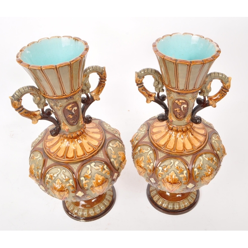 441 - Wilhelm Schiller & Sons - A pair of late 19th century majolica twin handled vases, numbered 2176... 