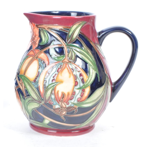 459 - Moorcroft pottery - A 21st century 2003 jug, decorated in the Pleuriana pattern, designed by Rachel ... 