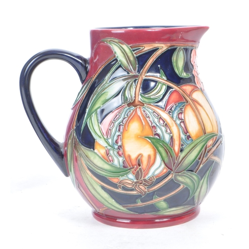 459 - Moorcroft pottery - A 21st century 2003 jug, decorated in the Pleuriana pattern, designed by Rachel ... 