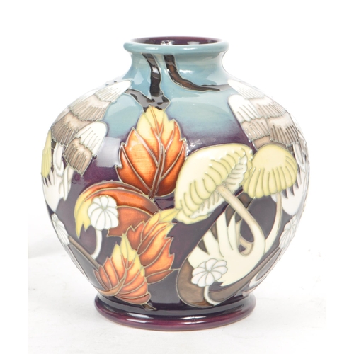 460 - Moorcroft Pottery - A 21st century 2011 'Lionshield' patterned vase, designed by Vicky Lovatt and a ... 