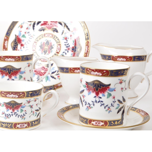 463 - Royal Worcester - 1994 bone china tea service pieces, featuring the Prince Regent pattern, a red and... 