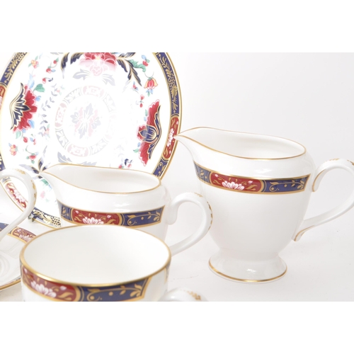 463 - Royal Worcester - 1994 bone china tea service pieces, featuring the Prince Regent pattern, a red and... 