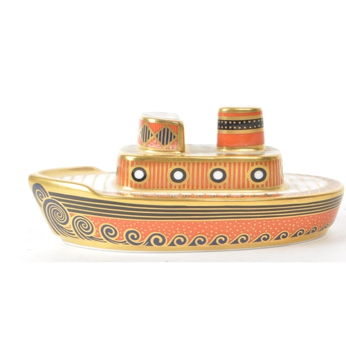 464 - Royal Crown Derby - A 2002 MMIII bone china 'Treasures of Childhood Tugboat' paperweight figure. Fea... 