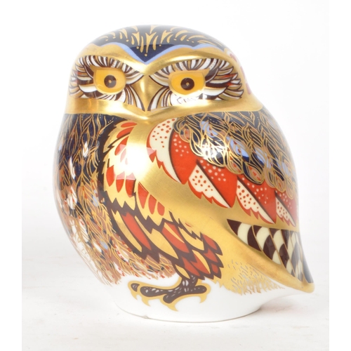 466 - Royal Crown Derby - Two 21st century porcelain owl paperweights, comprised of a 2005 MMV orange and ... 