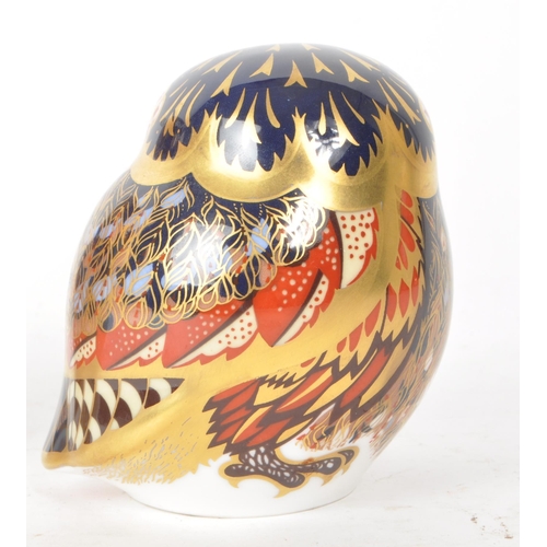 466 - Royal Crown Derby - Two 21st century porcelain owl paperweights, comprised of a 2005 MMV orange and ... 