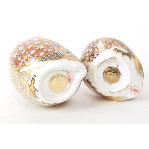 466 - Royal Crown Derby - Two 21st century porcelain owl paperweights, comprised of a 2005 MMV orange and ... 