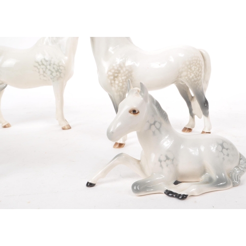 48 - Beswick - A collection of four 20th century dapple grey horse figures, comprising of: a Welsh Mounta... 