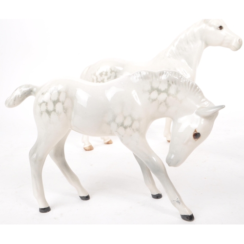 48 - Beswick - A collection of four 20th century dapple grey horse figures, comprising of: a Welsh Mounta... 