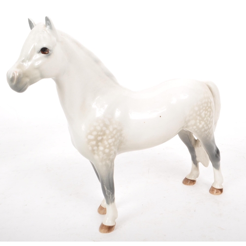 48 - Beswick - A collection of four 20th century dapple grey horse figures, comprising of: a Welsh Mounta... 