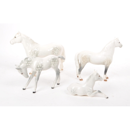 48 - Beswick - A collection of four 20th century dapple grey horse figures, comprising of: a Welsh Mounta... 