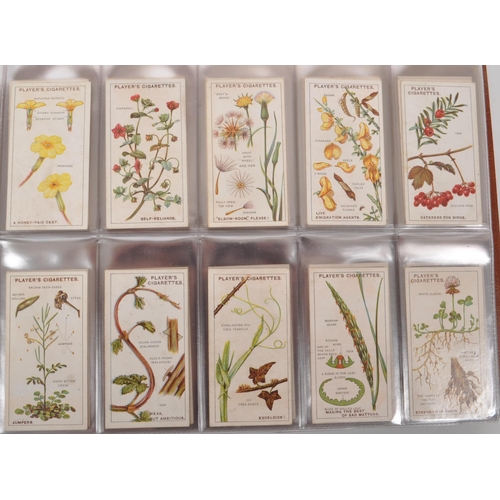 497 - A large collection of 20th century cigarette cards, housed in six albums and featuring examples from... 