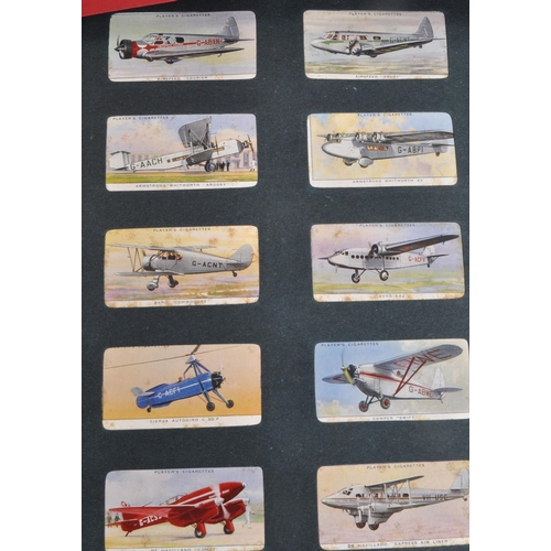 497 - A large collection of 20th century cigarette cards, housed in six albums and featuring examples from... 