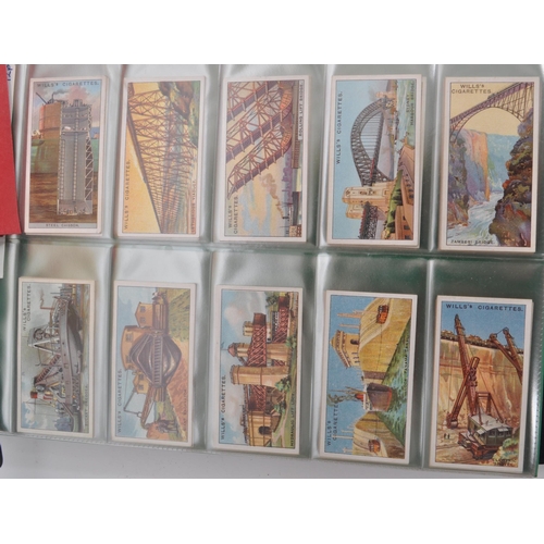 497 - A large collection of 20th century cigarette cards, housed in six albums and featuring examples from... 