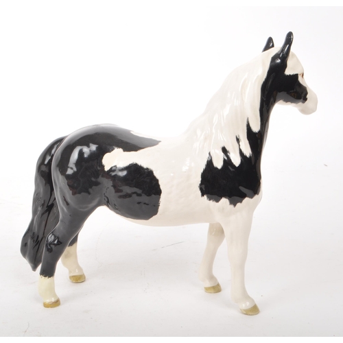 51 - Beswick - A late 20th-century porcelain Piebald Pinto pony / horse figurine no. 1373. Featuring blac... 