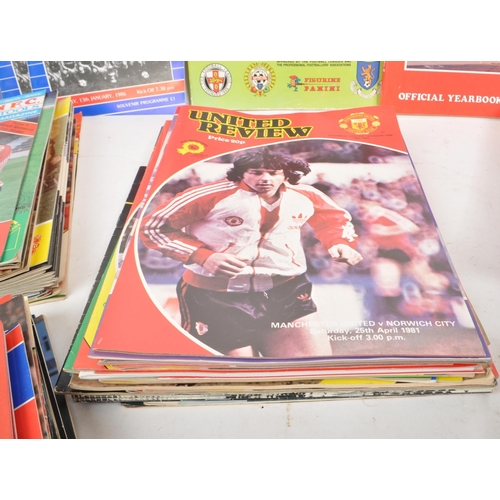 530 -  A large collection of 1980s football programmes, majority being Manchester United, with other examp... 