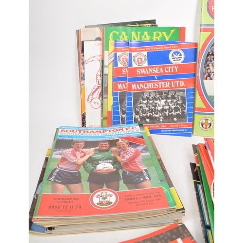 530 -  A large collection of 1980s football programmes, majority being Manchester United, with other examp... 