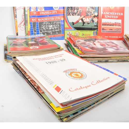 530 -  A large collection of 1980s football programmes, majority being Manchester United, with other examp... 