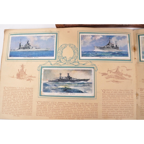 532 - A collection of early 20th century cigarette cards, and two vintage cigarette packets from W.D. &... 