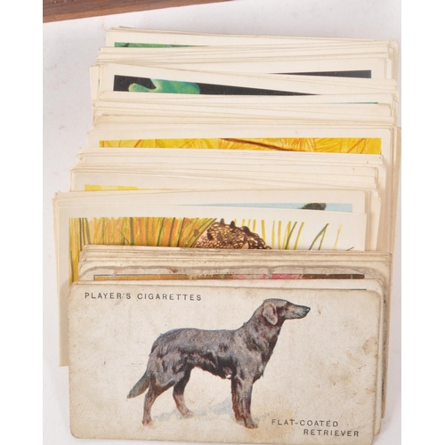 532 - A collection of early 20th century cigarette cards, and two vintage cigarette packets from W.D. &... 