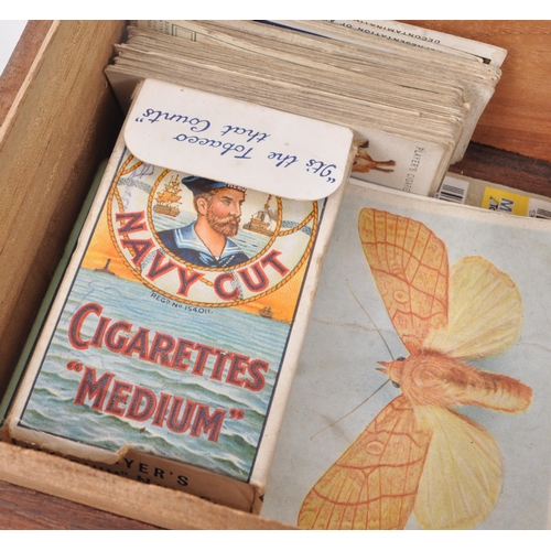 532 - A collection of early 20th century cigarette cards, and two vintage cigarette packets from W.D. &... 