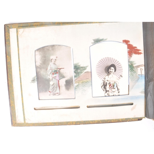 537 - A collection of early 20th-century Japanese hand-coloured postcards and photographs, housed within a... 