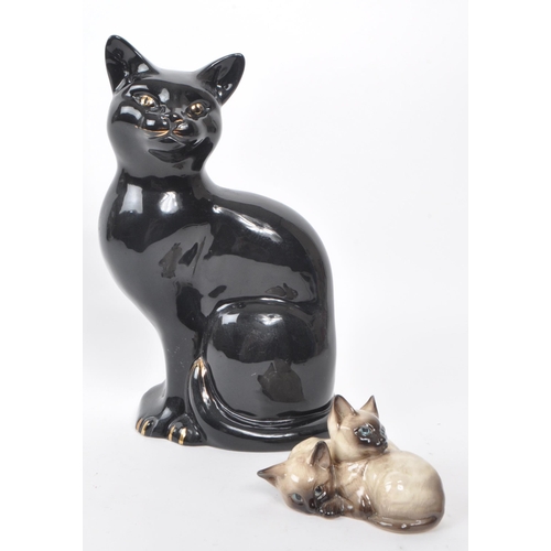 60 - Beswick - Two 20th-century glazed porcelain cat figures, comprising of a sitting black cat, no. 1561... 