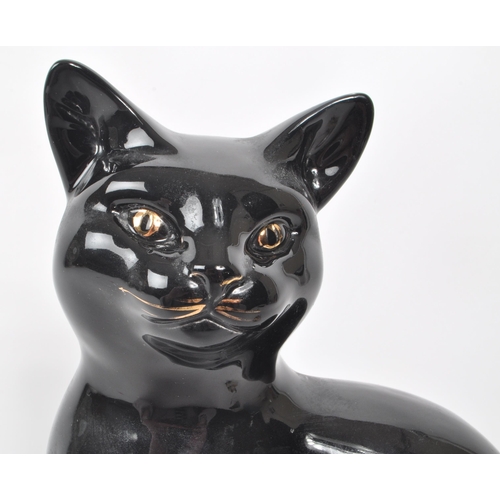 60 - Beswick - Two 20th-century glazed porcelain cat figures, comprising of a sitting black cat, no. 1561... 