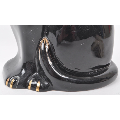 60 - Beswick - Two 20th-century glazed porcelain cat figures, comprising of a sitting black cat, no. 1561... 