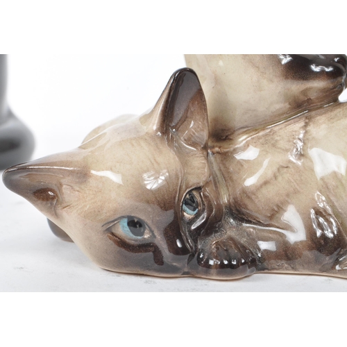 60 - Beswick - Two 20th-century glazed porcelain cat figures, comprising of a sitting black cat, no. 1561... 