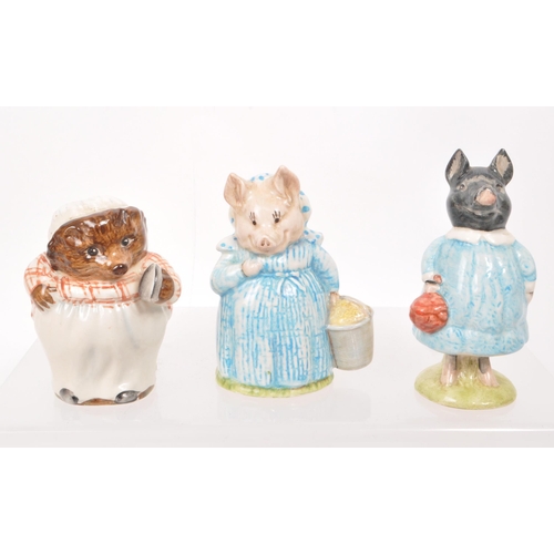 64 - Beswick - A collection of thirteen mid-century porcelain Beatrix Potter figures, including, 'Miss Mo... 