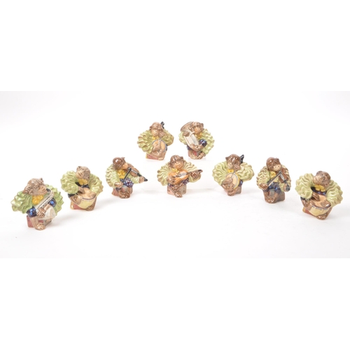 7 - Beswick - A collection of nine 1950s porcelain monkey band figurines, to include the full set of six... 