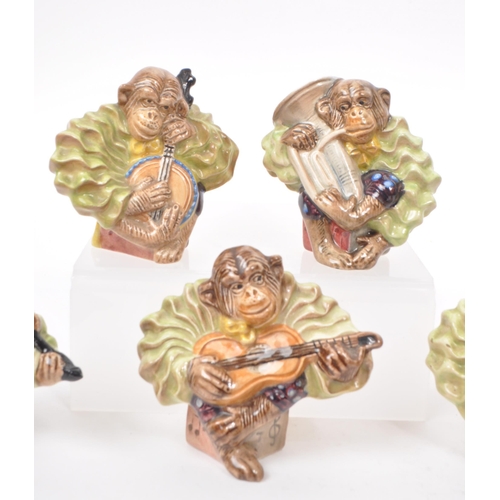 7 - Beswick - A collection of nine 1950s porcelain monkey band figurines, to include the full set of six... 