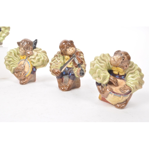 7 - Beswick - A collection of nine 1950s porcelain monkey band figurines, to include the full set of six... 