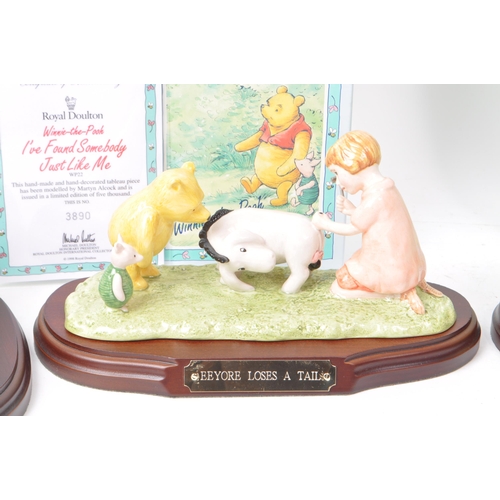 77 - Royal Doulton - Collection of four late 20th century Winnie-the-Pooh porcelain figurines, comprising... 