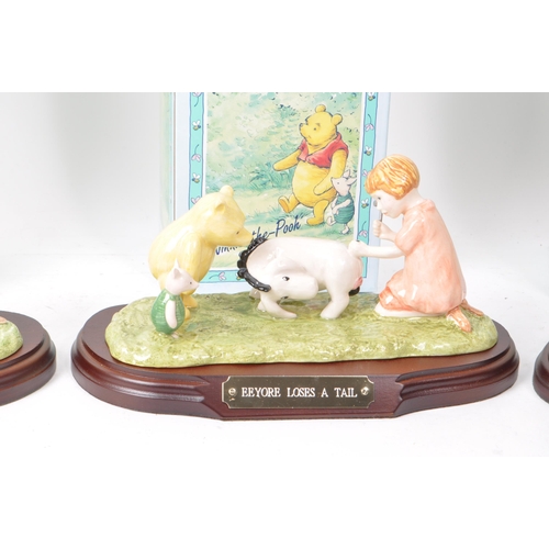 77 - Royal Doulton - Collection of four late 20th century Winnie-the-Pooh porcelain figurines, comprising... 