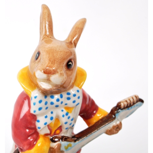 78 - Royal Doulton - Bunnykins - A 20th century porcelain 'Hey Jude' music box. Featuring a bunny in a pu... 