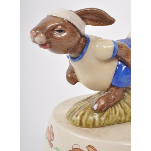 79 - Royal Doulton - Bunnykins - A 1984 porcelain 'King of The Road' music box. Featuring a bunny in a wh... 