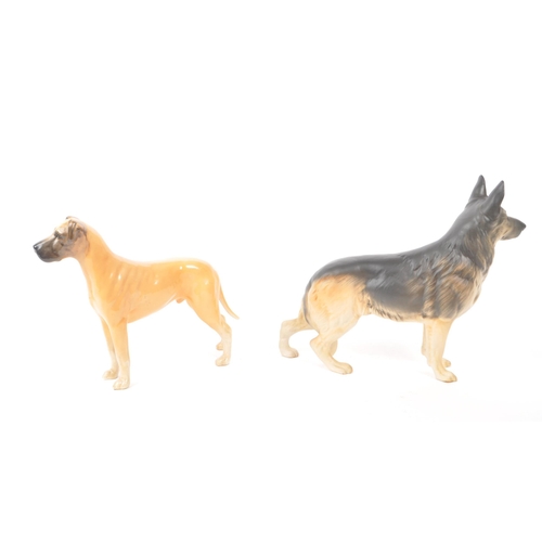 8 - Beswick - Two 20th century porcelain dog figurines, comprising of a CH Ruler of Ouborough, and an Al... 