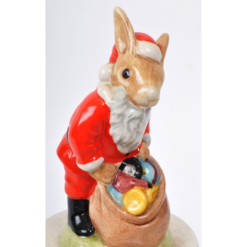 81 - Royal Doulton - Bunnykins - Three 20th-century Christmas music boxes. Comprising of two 'Carol Singe... 