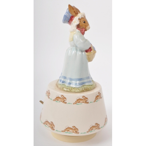 82 - Royal Doulton Tableware - Bunnykins - A 1980s porcelain 'Easter Parade' music box. Featuring 'Mrs Bu... 