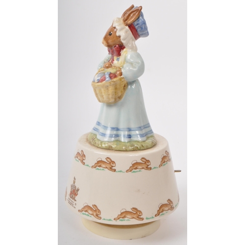 82 - Royal Doulton Tableware - Bunnykins - A 1980s porcelain 'Easter Parade' music box. Featuring 'Mrs Bu... 