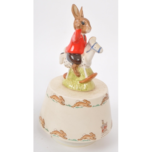 83 - Royal Doulton - Bunnykins - Two 20th-century porcelain music boxes. Comprising of 'Rock-A-Bye Baby' ... 