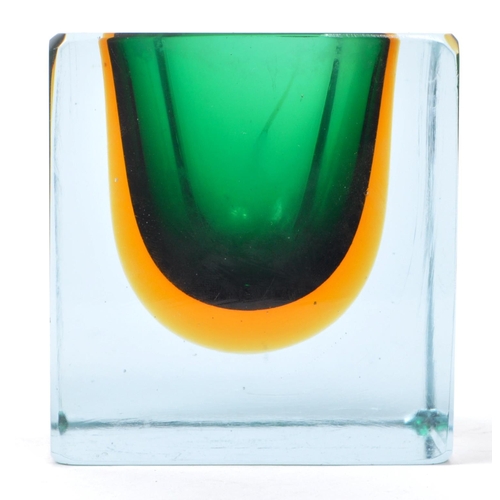 90 - A vintage mid 20th century studio art glass vase. The vase of cube form, with green and yellow colou... 